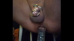 Riding biggest dildo in chastity Thumb