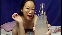 Cute girl drinking water at home Thumb